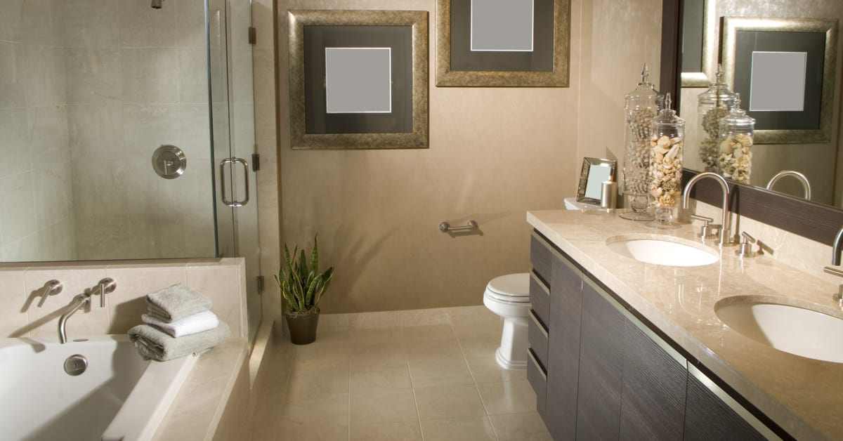 Renovated bathroom with double vanity and glass shower
