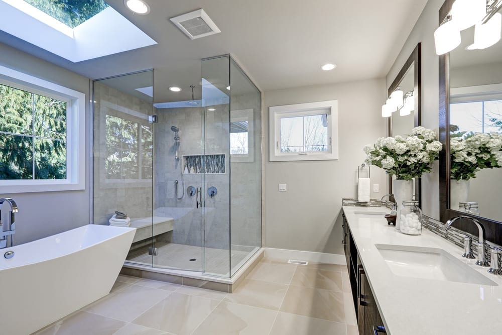 Completed frameless glass walk-in shower with a built-in tiled bench