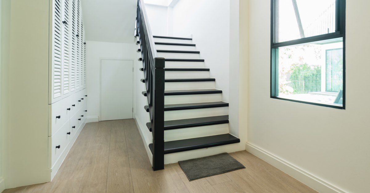Staircase with black-painted treads and risers