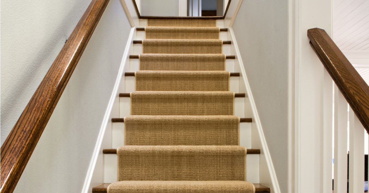 Staircase with a woven stair runner
