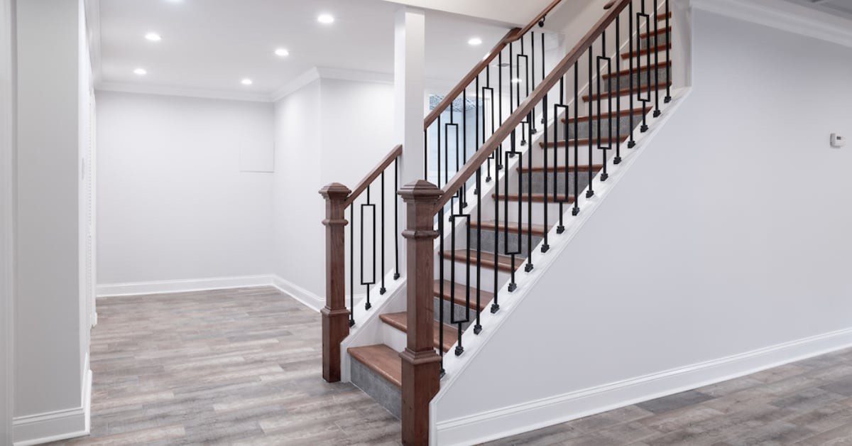 Basement staircase with wood and iron railing
